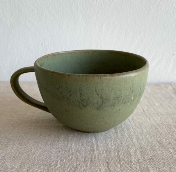 Green ceramic cup on the table_2