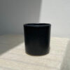 Black ceramic mug on the table
